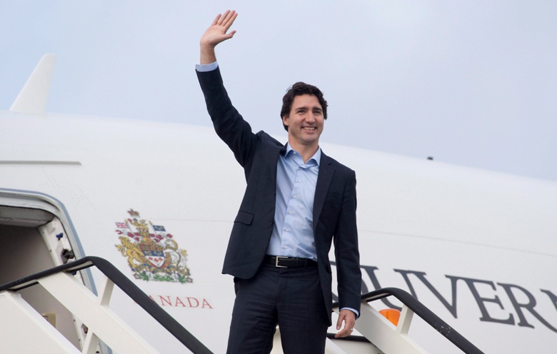 Canadian Prime Minister Justin Trudeau as he boards a government plane before leaving the United Kingdom Thursday November 26, 2015 in Luton, England. Trudeau is heading to Malta for the Commonwealths Heads of Government meeting.