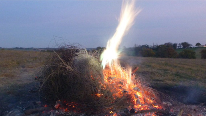 A Saskatoon man has been charged after a suspicious fire on city property was spotted by members of the police air support unit.