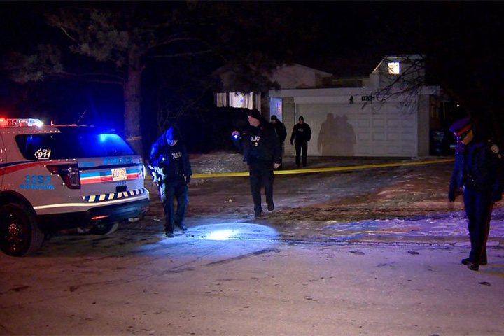 Police investigate the scene on Woodsworth Road after a shooting early Sunday.