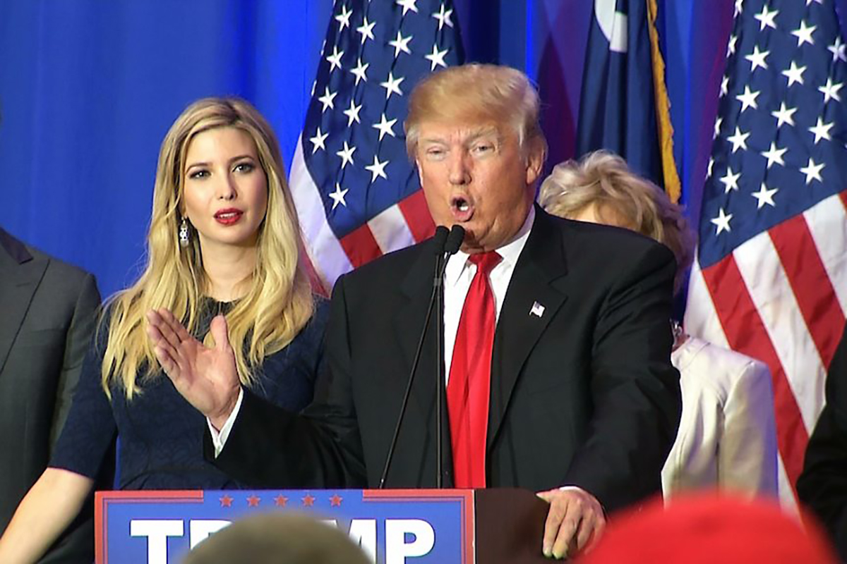 Ivanka Trump, the daughter of Republican presidential candidate Donald Trump, looks on as her father addresses supporters in Spartanburg, South Carolina, on Saturday, Feb. 20, 2016. 