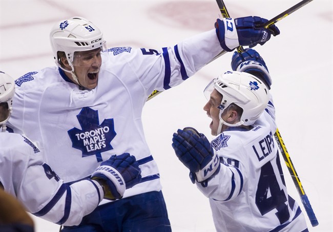 Toronto Maple Leafs' Brendan Leipsic (49) celebrates his first career NHL goal with teammate Jake Gardiner on Saturday night.