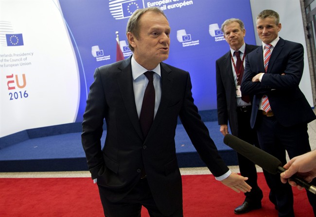 European Council President Donald Tusk speaks with journalists as he arrives at the European Council building in Brussels on Wednesday, Feb. 17, 2016. European Union leaders will hold a summit in Brussels on Thursday and Friday to hammer out a deal designed to keep Britain in the 28-nation bloc.