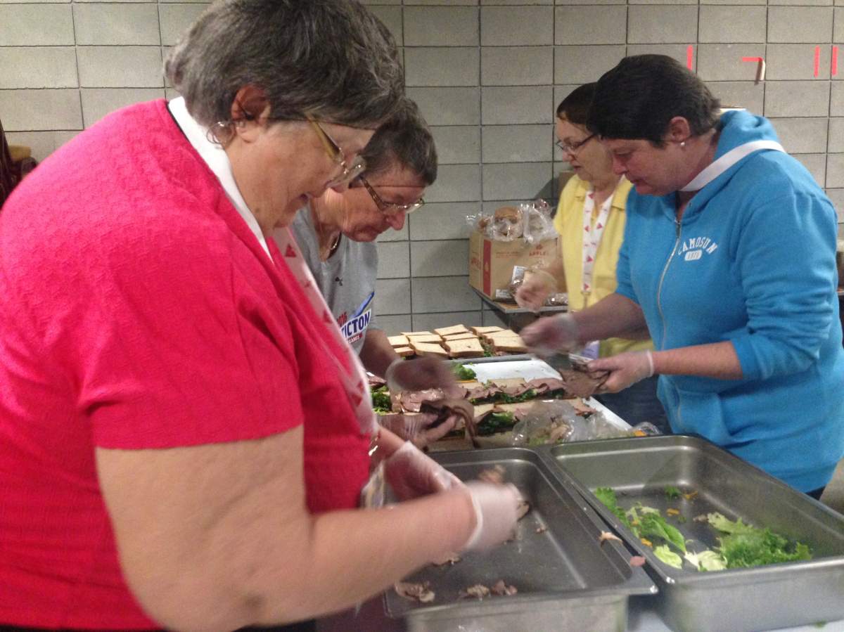 These volunteers have the important task of feeding the athletes.