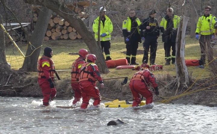 First responders attend the scene at the Credit River in Caledon, Ont., after one kayaker was declared dead and a second missing.