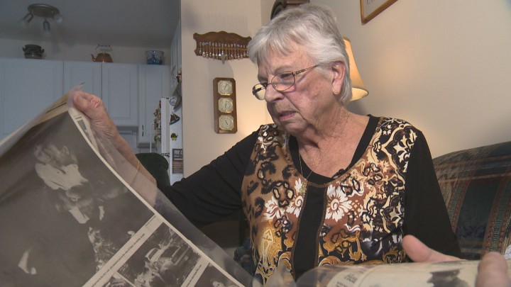 Betty Bartelds sits in her Edmonton home sifting through old photos.