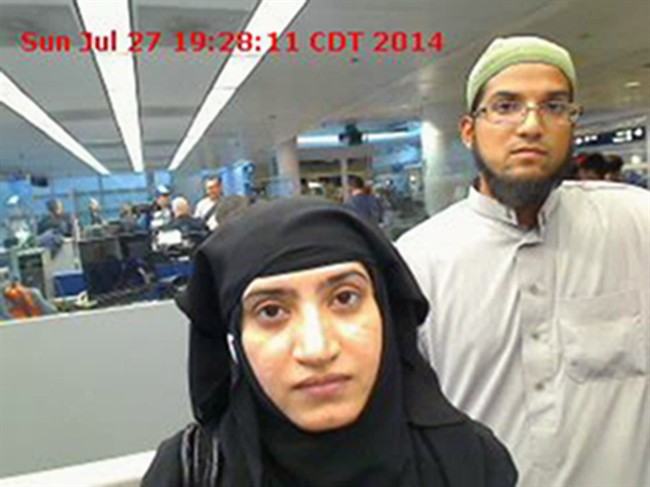 This July 27, 2014, photo provided by U.S. Customs and Border Protection shows Tashfeen Malik, left, and Syed Farook, as they passed through O'Hare International Airport in Chicago.