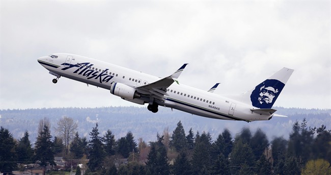 In this photo taken March 24, 2015, an Alaska Airlines jet takes off at Seattle-Tacoma International Airport in SeaTac, Wash.