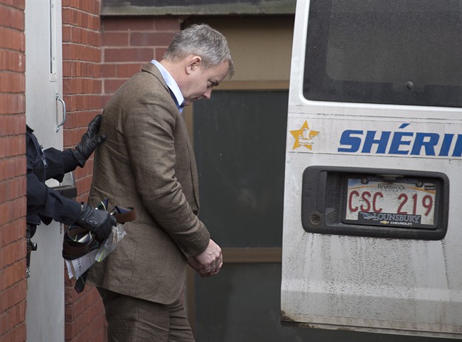 Dennis Oland is taken away after being denied bail pending the appeal of his second-degree murder conviction at the Court of Appeal in Fredericton, N.B. on Wednesday, Feb. 17, 2016. 