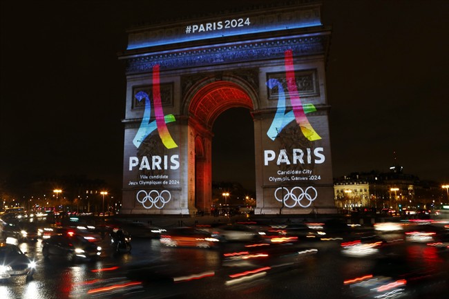 The Eiffel Tower-shaped bid logo for the Paris 2024 is unveiled on The Arc of Triomphe on the Champs Elysees in Paris, France, Tuesday, Feb. 9, 2016. 