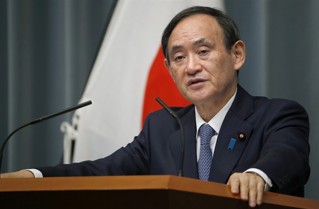 Japan's Chief Cabinet Secretary Yoshihide Suga speaks to the media during a press conference at Prime Minister's official residence in Tokyo, Wednesday, Feb. 10, 2016.