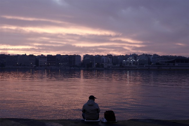 A man fishing during a 24-hour general strike at the Athens' port of Piraeus, on Thursday, Feb. 4, 2016. Services across the country have ground to a halt as Greeks walk off the job in a massive general strike that cancelled flights, ferries and public transport, shut down schools and pharmacies and left public hospitals with emergency staff.