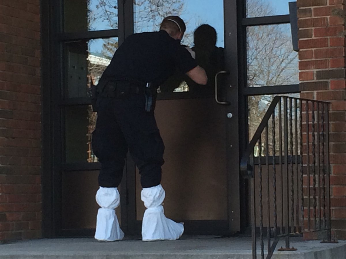 Police investigate an apartment near 114 Avenue and 132 Street, Monday, March 28, 2016.