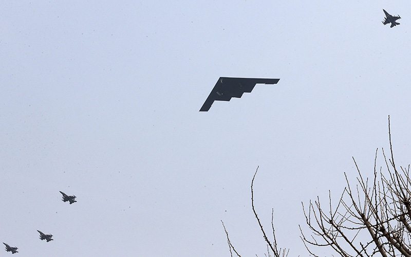 U.S. Air Force B-2 stealth bomber flies over near Osan U.S. Air Base in Pyeongtaek, south of Seoul, South Korea, Thursday, March 28, 2013. 