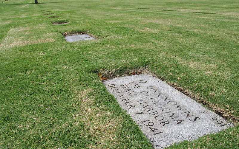 A gravestone marking 12 sets of unidentified remains from the USS Oklahoma buried at the National Memorial Cemetery of the Pacific in Honolulu. 