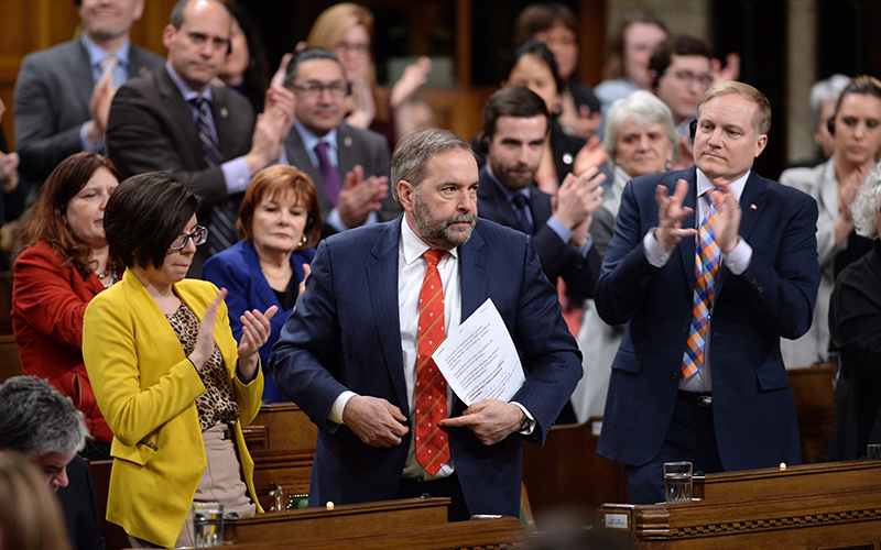 NDP Leader Tom Mulcair stands and is applauded during question period in the House of Commons on Parliament Hill in Ottawa on Feb. 17, 2016. 