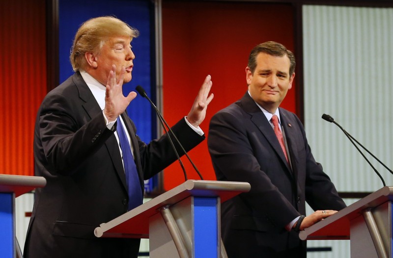 Republican presidential candidate, Sen. Ted Cruz, R-Texas, right, reacts as businessman Donald Trump speaks during a Republican presidential primary debate at Fox Theatre, Thursday, March 3, 2016, in Detroit.