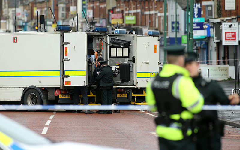 Police officers stand beside British Army Bomb disposal teams in this photo taken in Belfast, Northern Ireland on March 4, 2016.