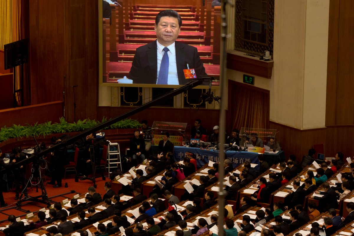 Chinese President Xi Jinping is displayed on a large screen during the opening session of the annual National People's Congress in Beijing's Great Hall of the People, Saturday, March 5, 2016. 