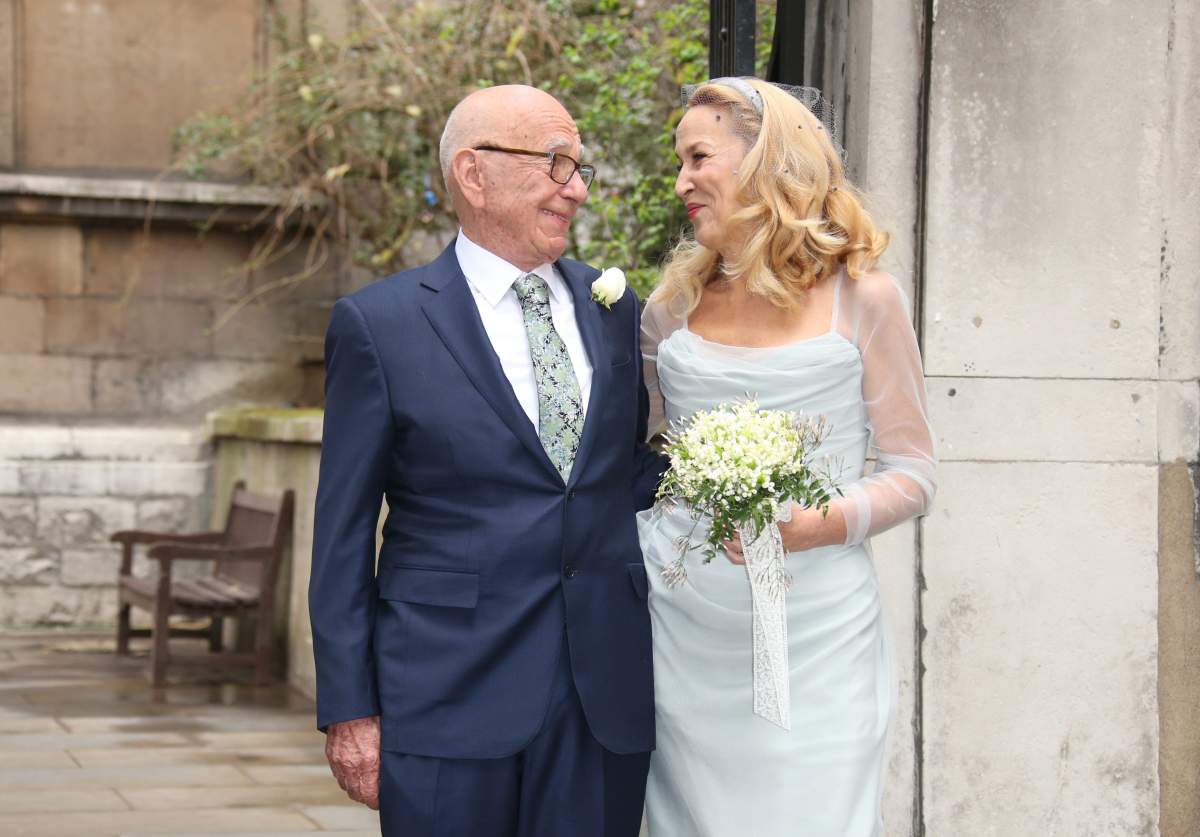 Rupert Murdoch, left, and Jerry Hall leave St Bride’s Church after the celebration ceremony of the wedding of Rupert Murdoch and Jerry Hall in London, Saturday, March 5, 2016. ()