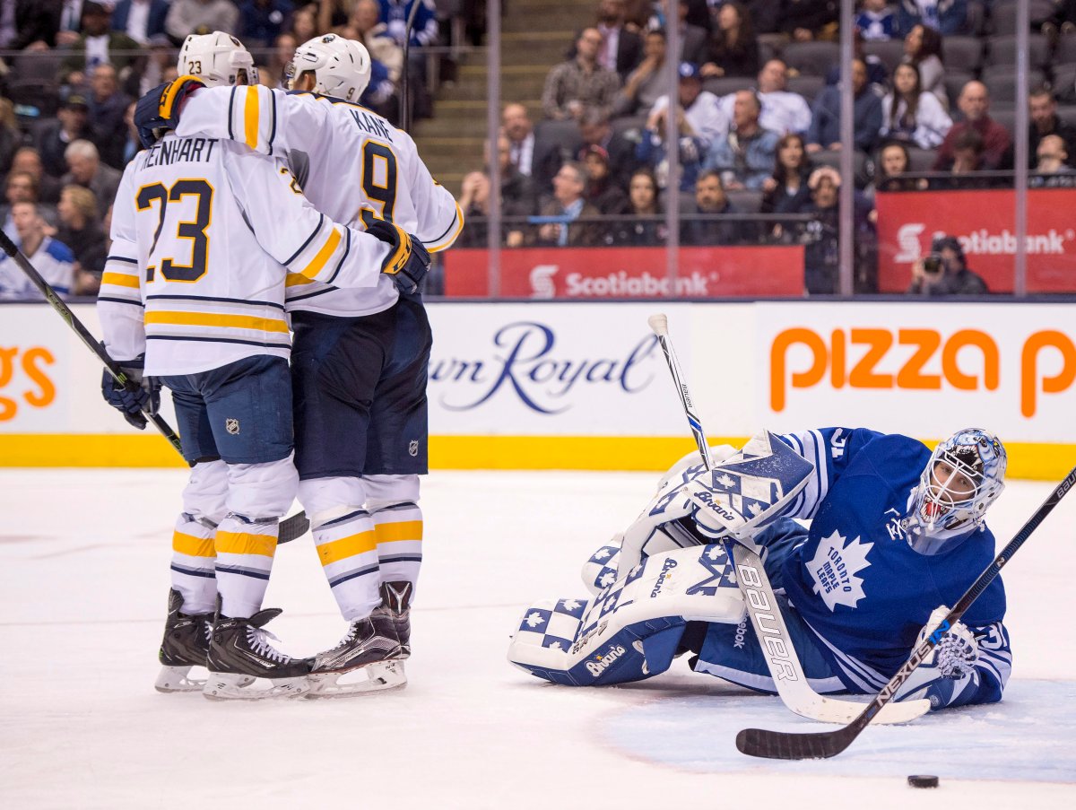 Buffalo Sabres' centre Sam Reinhart congratulates teammate Evander Kane on his game tying goal as Toronto Maple Leafs goaltender Garret Sparks reacts during third period NHL action in Toronto on Monday, March 7, 2016. 