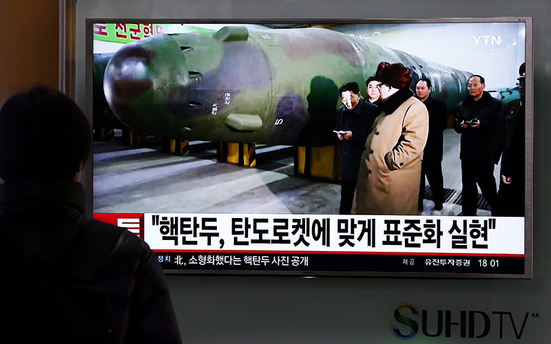 A South Korean watches TV news showing North Korean leader Kim Yong Un, on a sreen at the Seoul station, in Seoul, South Korea, 09 March 2016. 