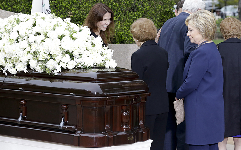 Hillary Clinton looks at the casket during the graveside service for Nancy Reagan at the Ronald Reagan Presidential Library, Friday, March 11, 2016 in Simi Valley, Calif. 