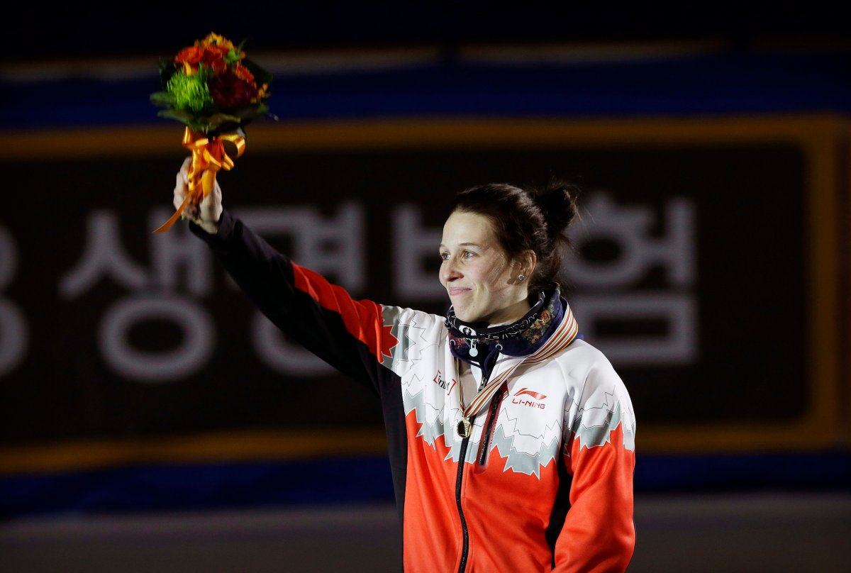 Gold medalist Marianne St-Gelais of Canada celebrates during the awards ceremony of the women's 1500 meter final at the ISU World Cup Short Track Speed Skating in Seoul, South Korea, Saturday, March 12, 2016. 