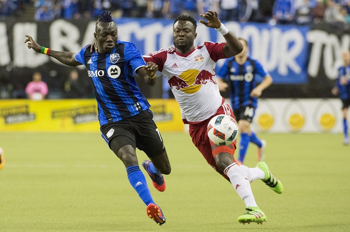 Montreal Impact's Dominic Oduro (7) challenges New York Red Bulls' Gideon Baah during first half MLS soccer action in Montreal Saturday, March 12, 2016. 