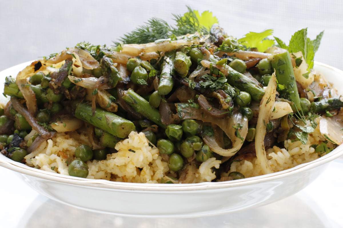 This March 7, 2016 photo shows spring vegetable pilau with fennel and asparagus in Concord, N.H. The combination of rice packed with spiced fennel, onions and garlic cooked slowly until soft and finished with still-crisp asparagus and peas makes for a perfect spring dish. 