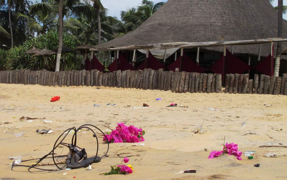 Flowers are laid on a beach where a recent attack took place in memory of people that lost their lives, in Grand Bassam, Ivory Coast. 