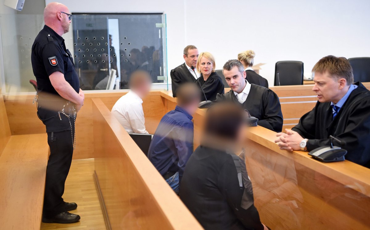 Defendants Dennis L., Sascha D. and Saskia B. sit in the 'Landgericht' district court prior to the hearing, in Hanover, Germany, 17 March 2016. The verdicts are being announced in the trial regarding an arson attack on an asylum seekers' accommodation in Salzhemmendorf. 