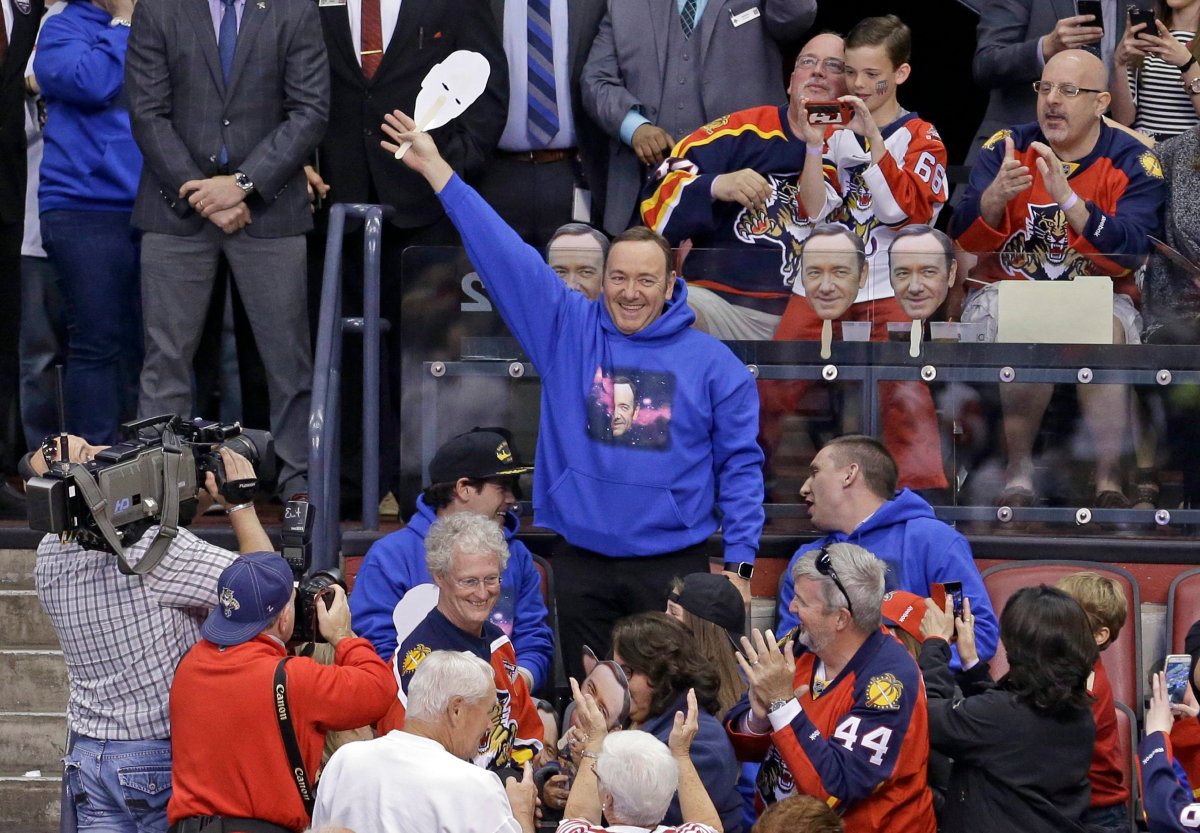 Actor Kevin Spacey waves to the fans during an NHL hockey game between the Florida Panthers and the Detroit Red Wings in Sunrise, Fla., Saturday, March 19, 2016.