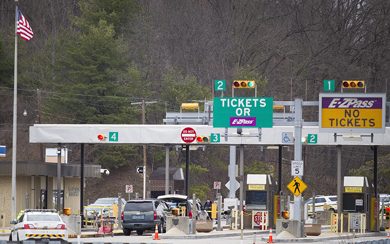 Police investigate at exit 180 off of the Pennsylvania Turnpike where a toll booth worker at the Fort Littleton Exchange was shot early Sunday, March 20, 2016 in an apparent robbery attempt. 