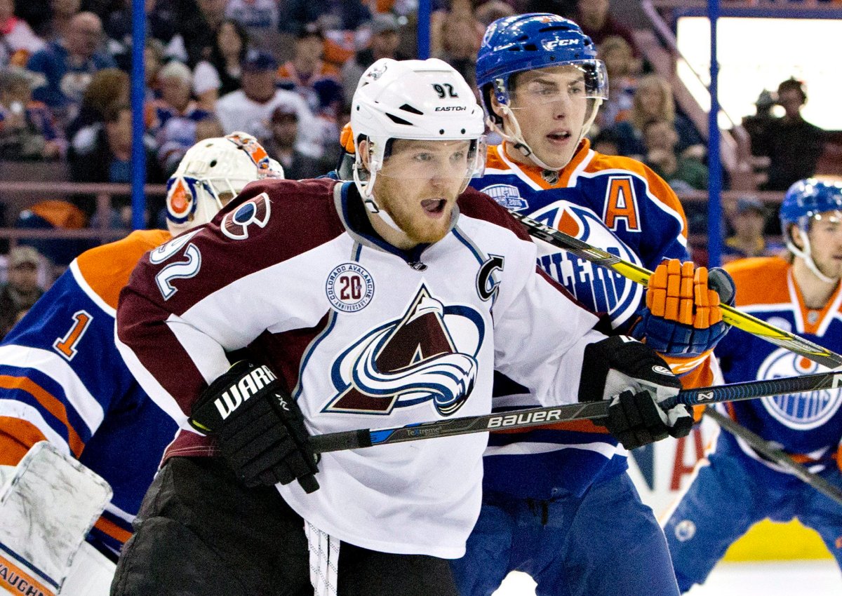 Colorado Avalanche's Gabriel Landeskog (92) and Edmonton Oilers' Ryan Nugent-Hopkins (93) battle in front of the net during first period NHL action in Edmonton, Alta., on Sunday March 20, 2016. 
