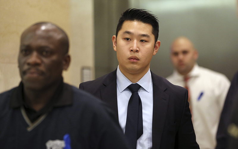 NYPD officer Peter Liang exits the courtroom during a break in closing arguments in his trial on charges in the shooting death of Akai Gurley, at Brooklyn Supreme court in New York. 