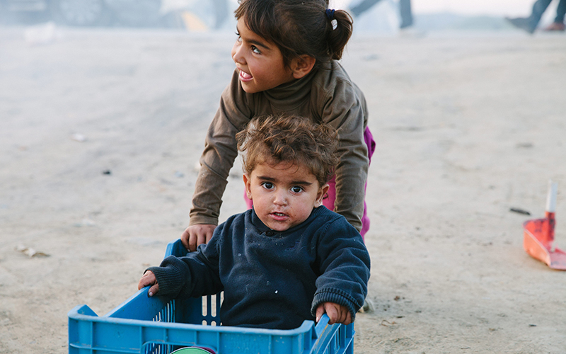 Two Syrian children play in a plastic box outside their tent in Idomeni, they have been waiting to cros the border for a month, but are being sent back to Turkey by the EU
Migrant crisis at Idomeni refugee camp, Greece - 29 Mar 2016.