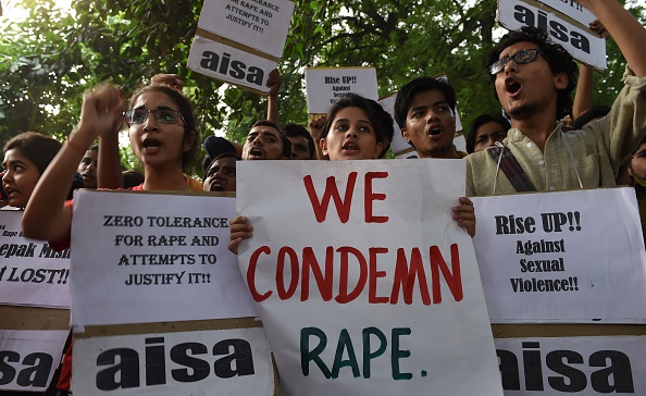 Indian students shout slogans during a protest against the rapes of two minor girls outside the police headquarters in New Delhi on October 18, 2015. 