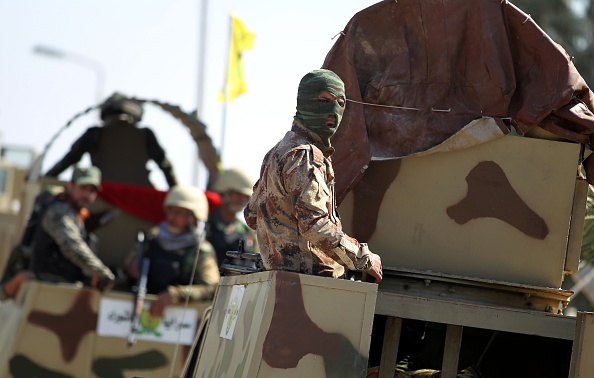 Iraqi Shiite fighters from the Popular Mobilisation units arrive to support the Iraqi security forces at an Iraqi army position where an attack was carried out by the Islamic State (IS) group jihadists in the Abu Ghraib area west of the Iraqi capital Baghdad, on February 29, 2016.
The jihadists attacked the position early in the morning and held it until government reinforcements arrived and took it back later in the day, the officials said.
The Abu Ghraib violence killed at least eight people, including both members of the security forces and allied paramilitaries, and wounded at least 22, while IS members were also killed, officials said. 