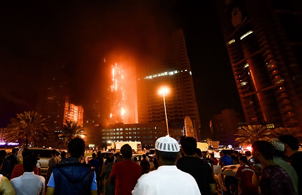 Fire engulfs a tower at a residential cluster in the northern UAE emirate of Ajman early on March 29, 2016.     