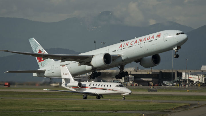An Air Canada Boeing 777-300ER wide-body jetliner takes off from Vancouver International Airport, Richmond, B.C. on Feb. 16. (File photo).