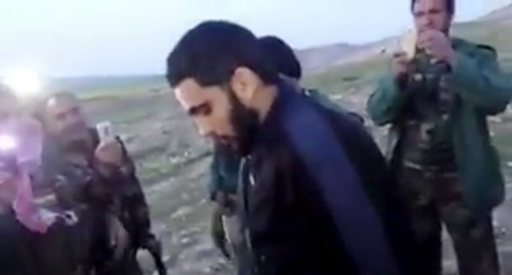 This image made from video posted on Twitter by a Kurdish fighter shows a man that the Kurdish military says is an American member of the Islamic State, group shortly after he turned himself in to Kurdish fighters in northern Iraq, Monday, March 14, 2016. 