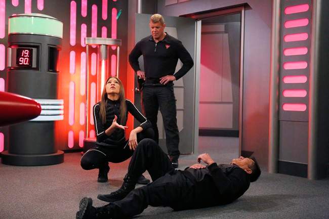 This image provided by Disney Channel shows, Zendaya, left, as K.C. Cooper and Lee Reherman, standing, as Victor, in the episode "Operation: Other Side, Part 2," of the television show "K.C. Undercover.”.