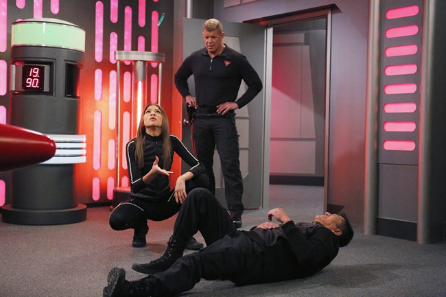 This image provided by Disney Channel shows, Zendaya, left, as K.C. Cooper and Lee Reherman, standing, as Victor, in the episode "Operation: Other Side, Part 2," of the television show "K.C. Undercover.”.