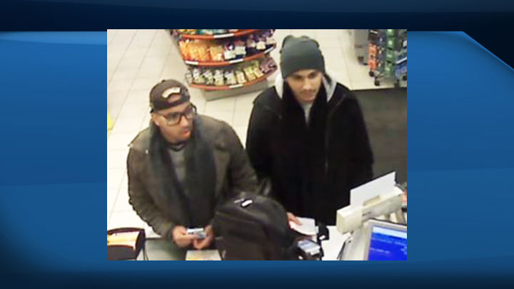Police have released this photo of two men believed to be tampering with point-of-sale terminals at Saskatoon businesses.