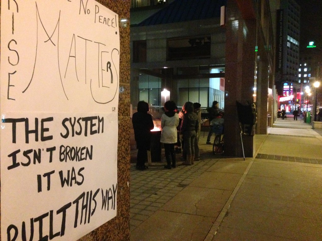 Black Lives Matter protesters occupy the area outside Toronto police headquarters on March 21, 2016.