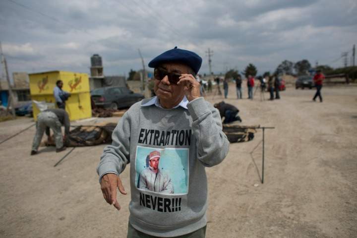 Jose Luis Gonzalez Meza, one of Joaquin "El Chapo" Guzman’s lawyers, talks to journalists as men set up a tent outside the Altiplano maximum security prison, where Gonzalez said he would hold a hunger strike in protest over the drug lord's treatment in prison, near Toluca, Mexico state, Mexico, Friday, March 4, 2016. 