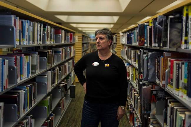 Maureen O'Reilly, a librarian and president of the Toronto Public Library Workers Union, poses for a portrait in Toronto on Thursday, March 24, 2016. They're part-time employees without health benefits or pensions who work split shifts at a number of different locations each week. From one paycheque to the next, their income fluctuates, as do their hours. THE CANADIAN PRESS/Christopher Katsarov.