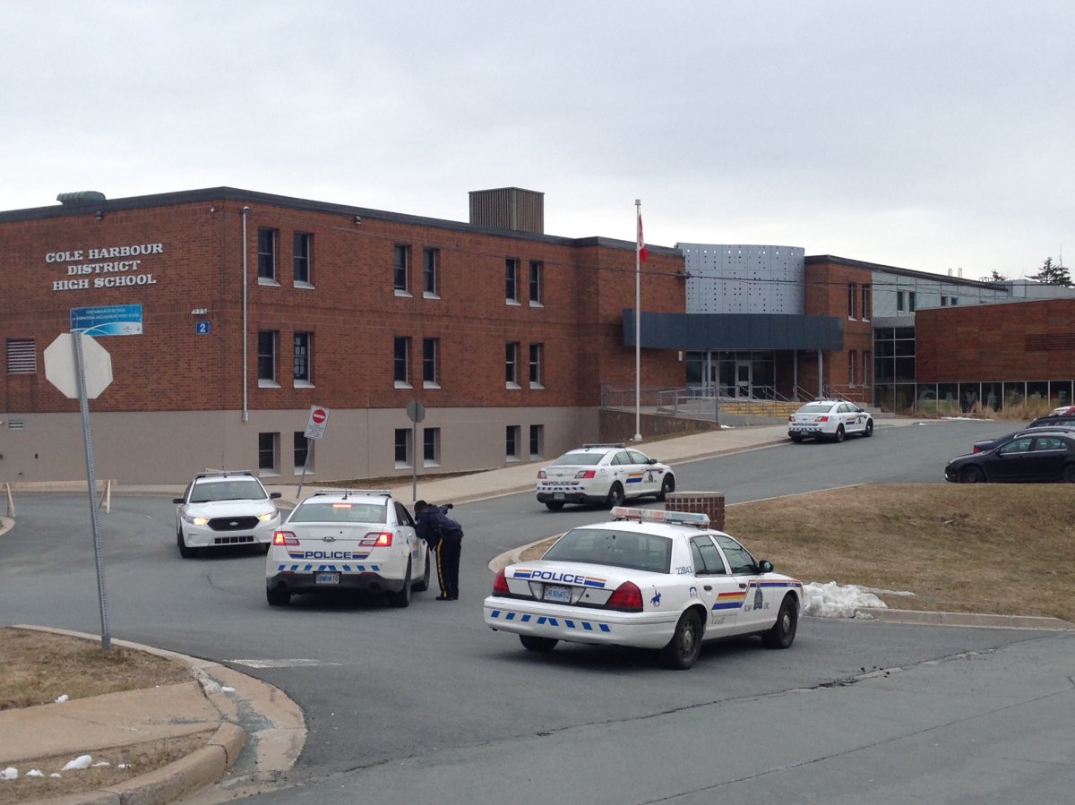 RCMP are pictured outside Cole Harbour District High School. Police responded to the scene following a tip that one student made a threat against another.