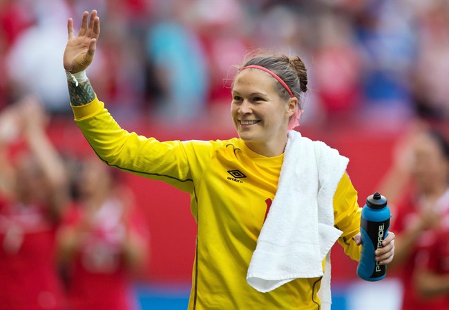 Canada goalkeeper Erin McLeod waves to fans after defeating Switzerland 1-0 in a FIFA Women's World Cup round of 16 soccer match in Vancouver on June 21, 2015. Canada will be without goalkeeper Erin McLeod as it prepares for the next step on the road to the Rio Olympics. And it appears the 33-year-old from St. Albert, Alta., is a long-term casualty.The Canadian Soccer Association said McLeod is "still assessing her options" after tearing her anterior cruciate ligament last week playing for her club team in Sweden. 