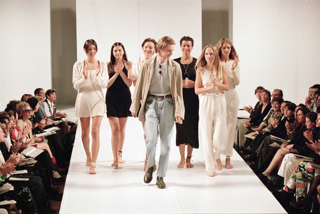 Toronto fashion designer James Yunker walks down the runway accompanied by models in an undated file photo.